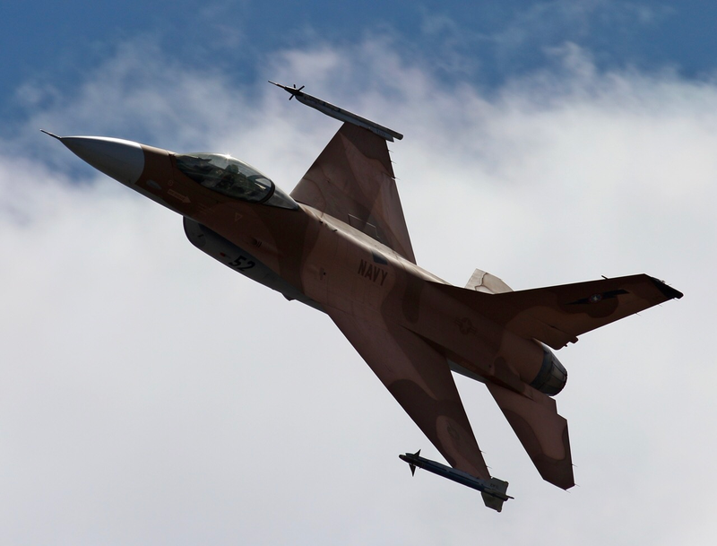 F-16s almost always fly with either Aim-9 Sidewinders or in combination with a targetting and data collection pod, usually in red.